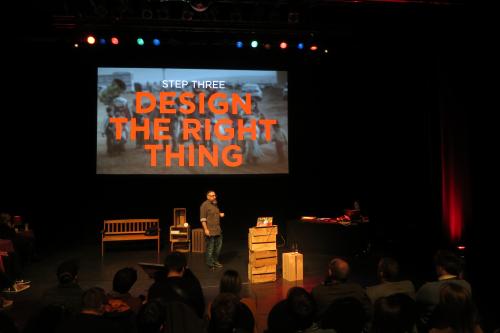 Mike on stage, with a slide 'Step three: Design the right thing'